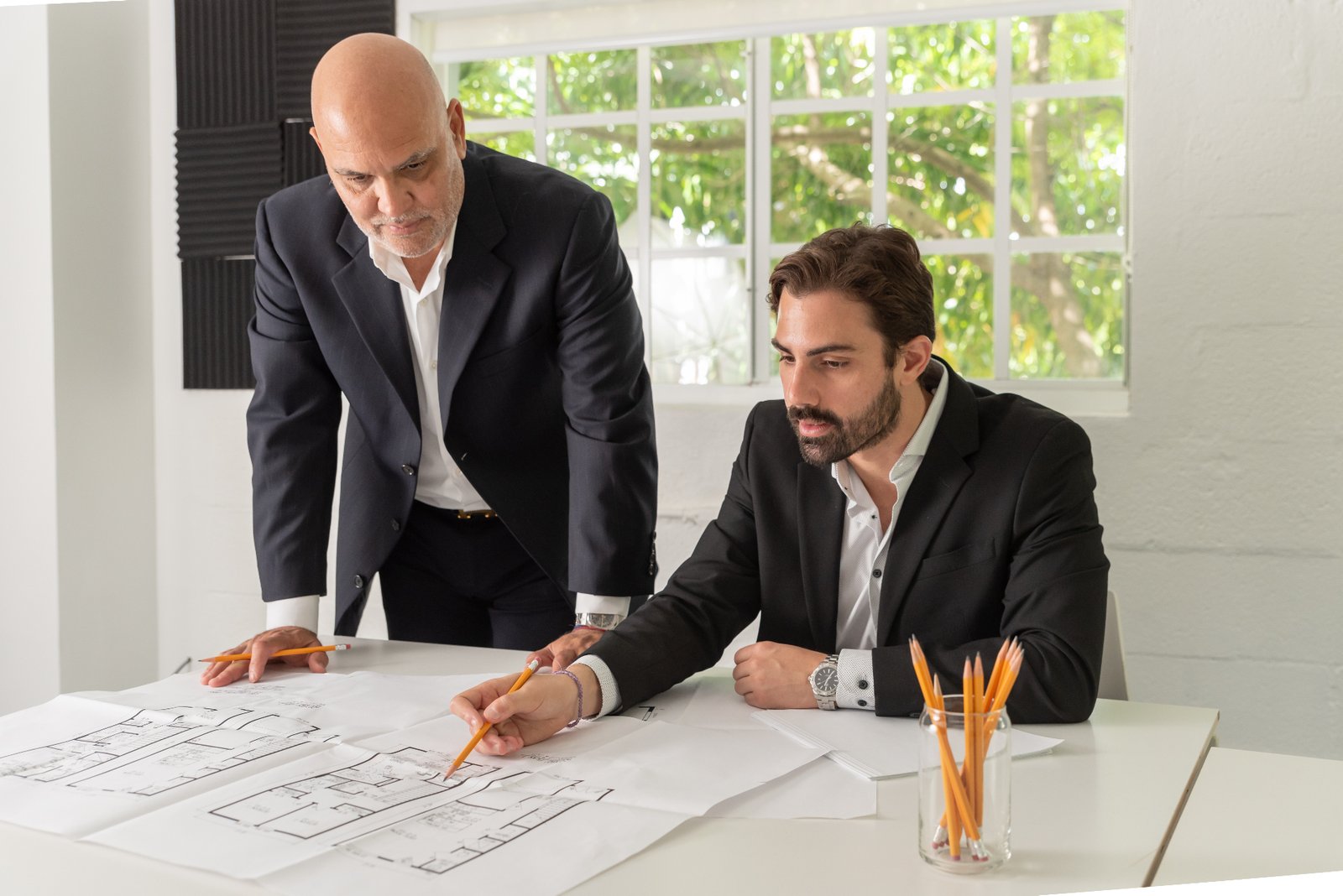 Mint Developers leadership reviewing architectural plans